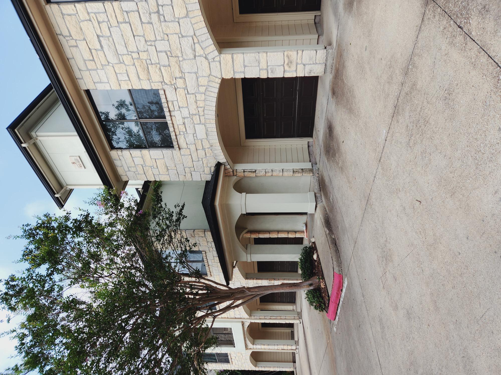 7701 Rialto Boulevard, Unit 833 Austin, TX 78735 - Photo 1 of 24 a front view of a house with yard