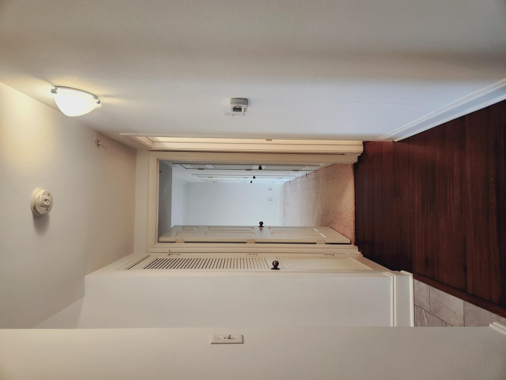7701 Rialto Boulevard, Unit 833 Austin, TX 78735 - Photo 12 of 24 a view of a hallway with wooden floor