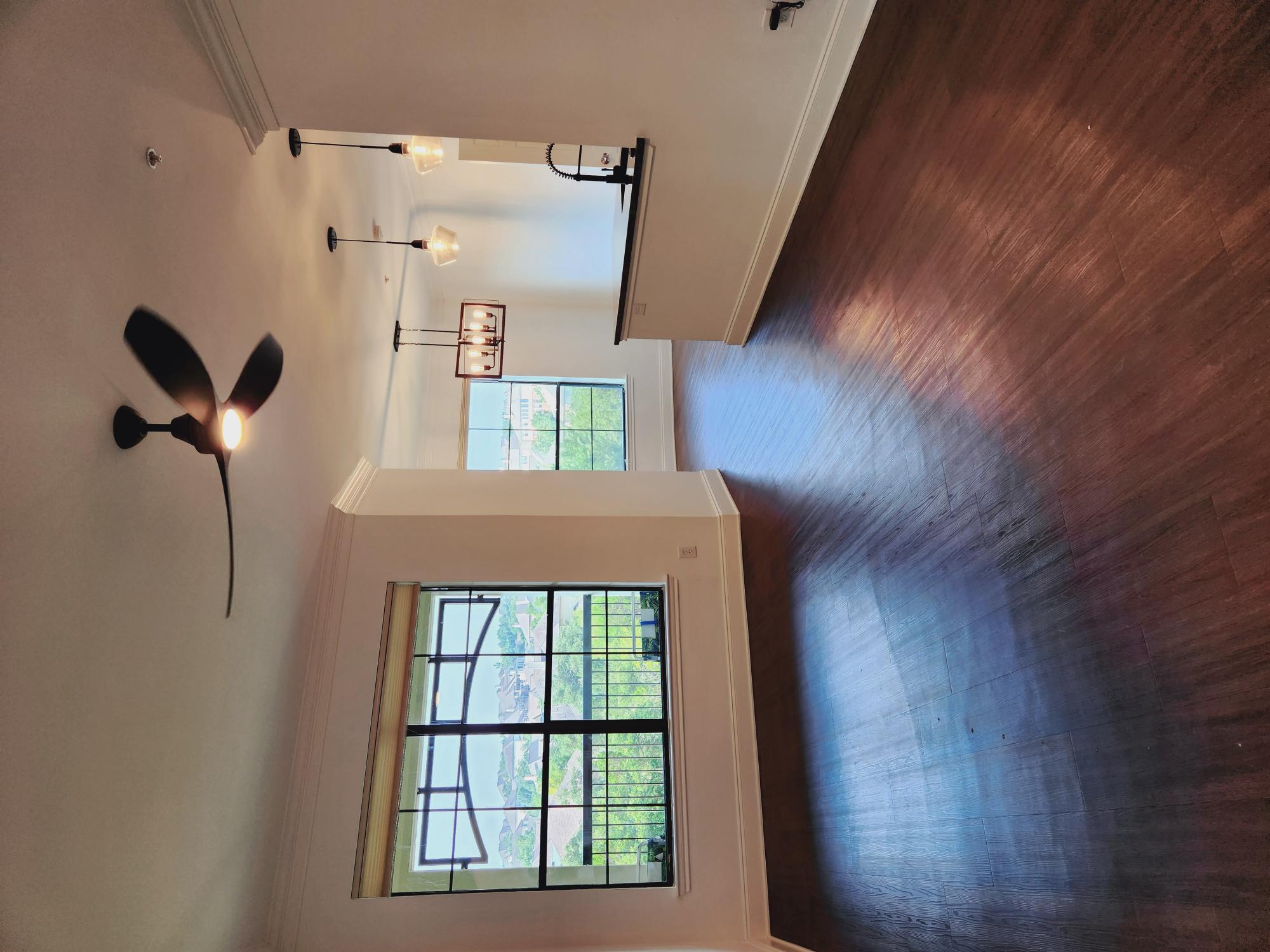 7701 Rialto Boulevard, Unit 833 Austin, TX 78735 - Photo 5 of 24 a view of a room with wooden floor and windows