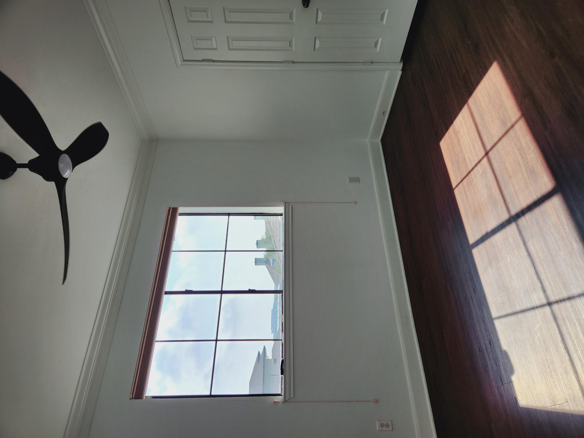 7701 Rialto Boulevard, Unit 833 Austin, TX 78735 - Photo 10 of 24 a view of empty room with wooden floor and fan
