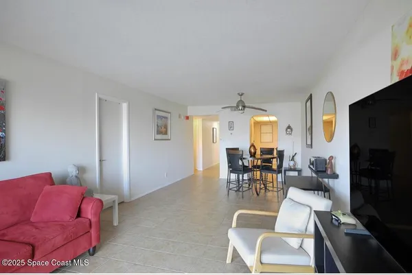 a view of a livingroom with furniture and a flat screen tv
