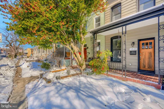a view of a house with a tree