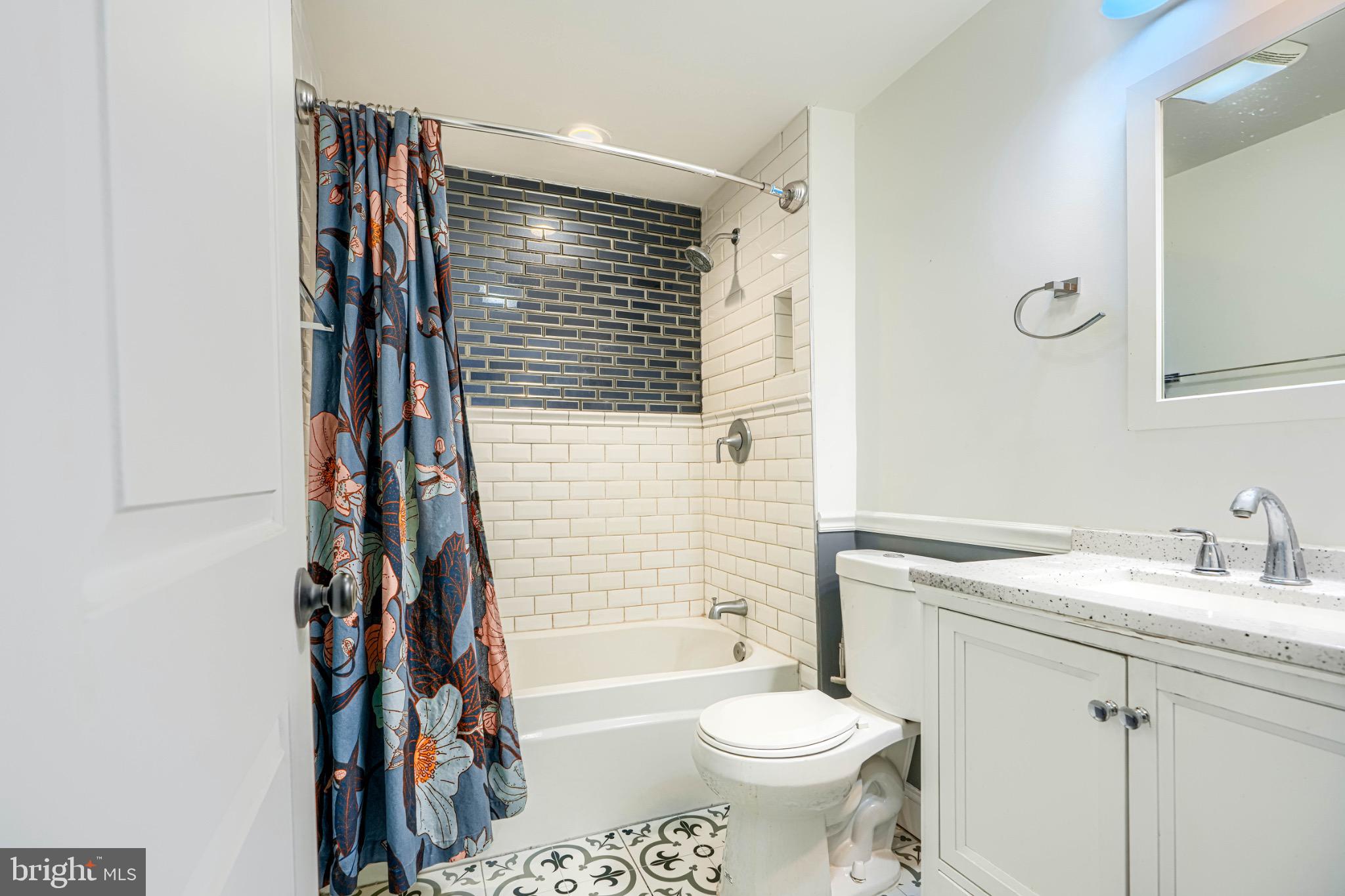 3533 Keswick Road Baltimore, MD 21211 - Photo 21 of 29 Chic bathroom with modern tile accents.
