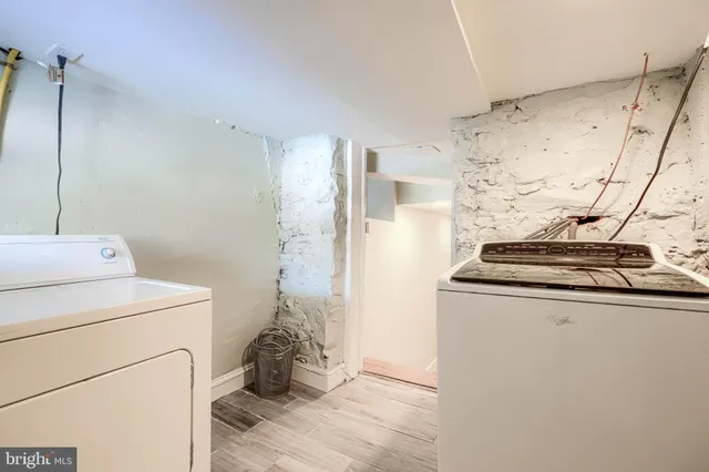 a view of an entryway front with brick walls