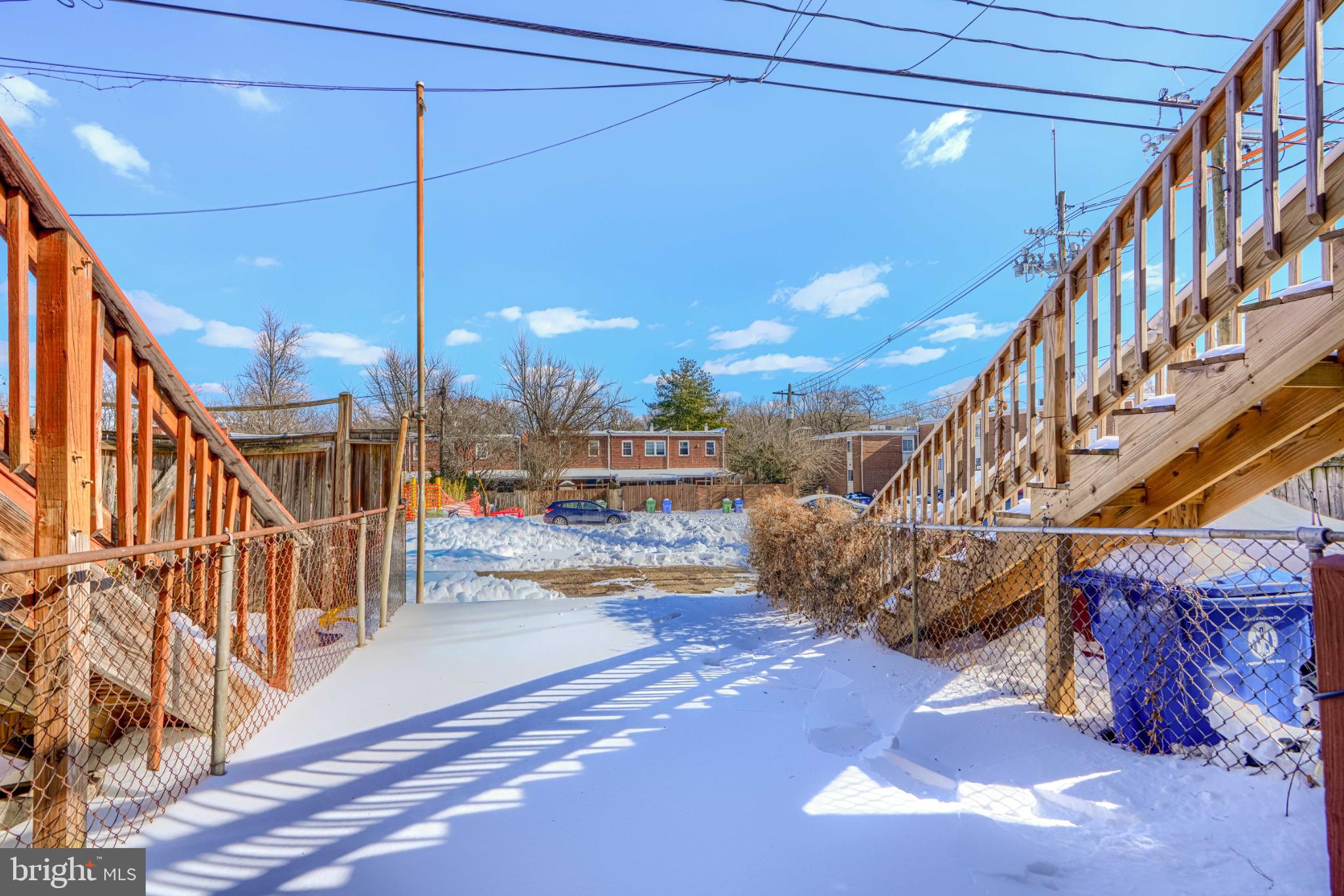 3533 Keswick Road Baltimore, MD 21211 - Photo 28 of 29 Charming winter scene with snowy pathways.