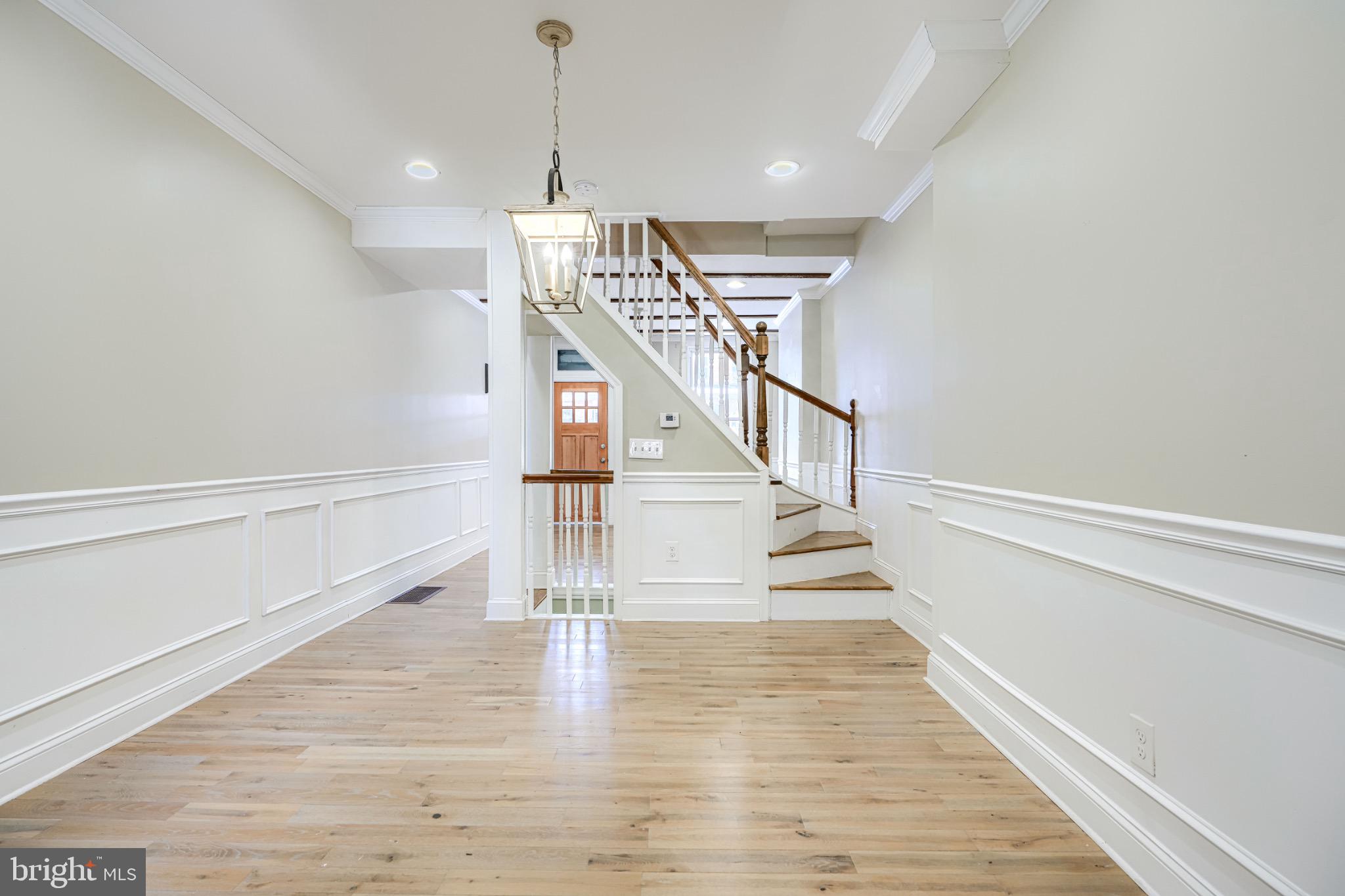 3533 Keswick Road Baltimore, MD 21211 - Photo 7 of 29 Inviting foyer with elegant staircase charm.
