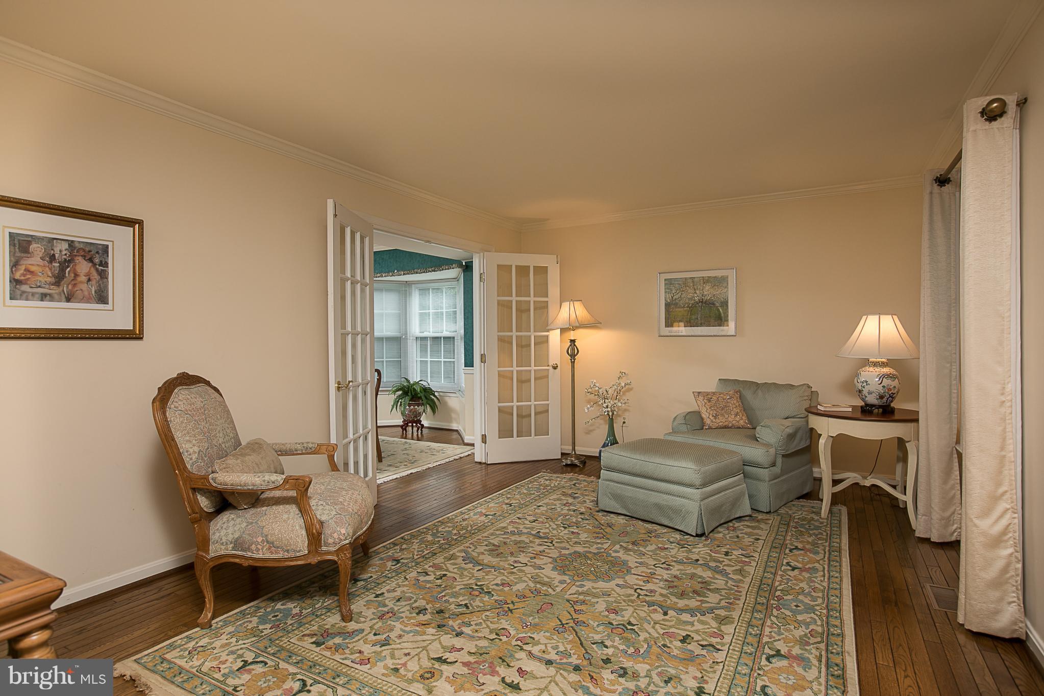 8530 Autumn Rust Road Ellicott City, MD 21043 - Photo 3 of 28 LIVING ROOM WITH HARDWOOD FLOORS