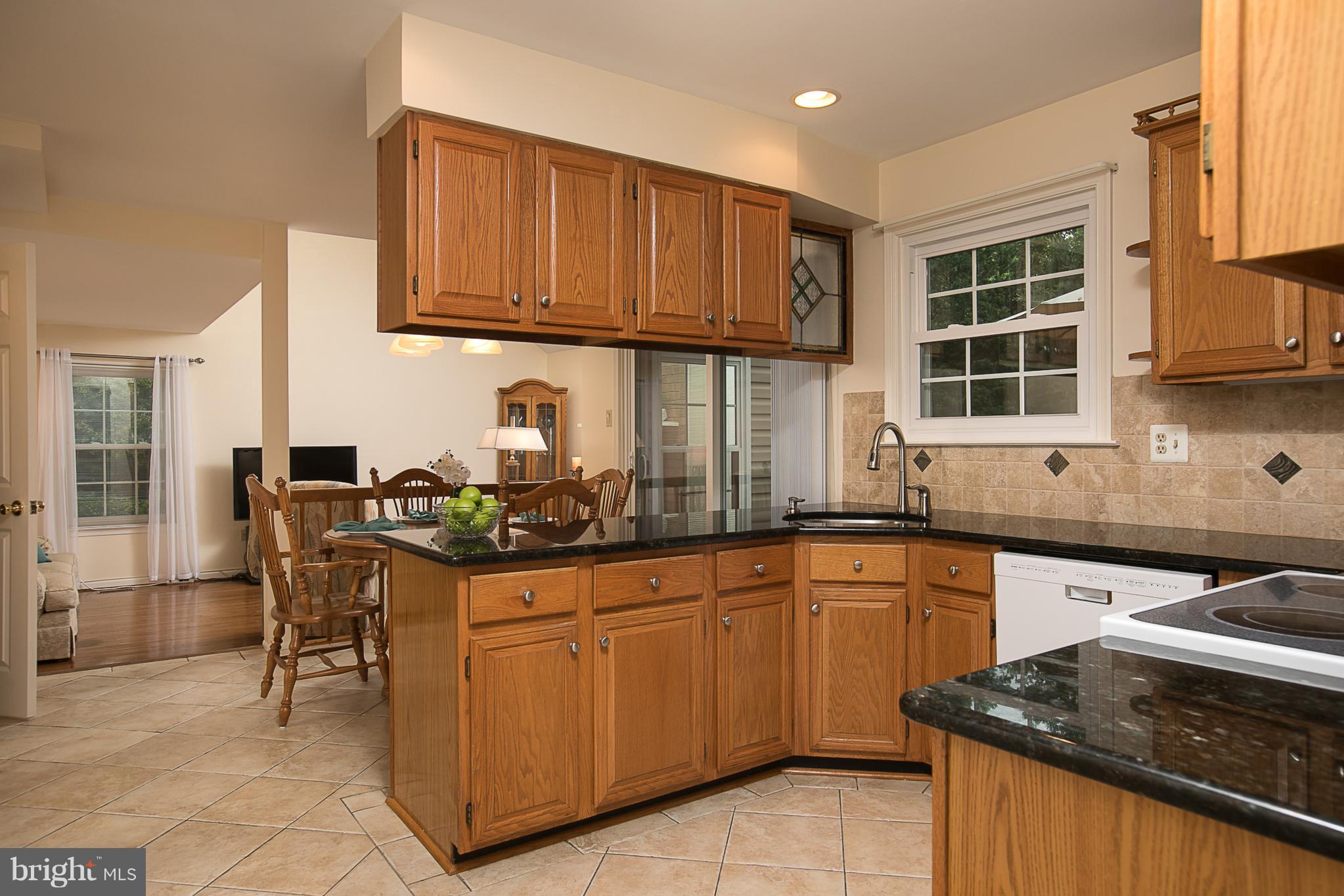 8530 Autumn Rust Road Ellicott City, MD 21043 - Photo 8 of 28 GRANITE COUNTERS + TILE FLOOR