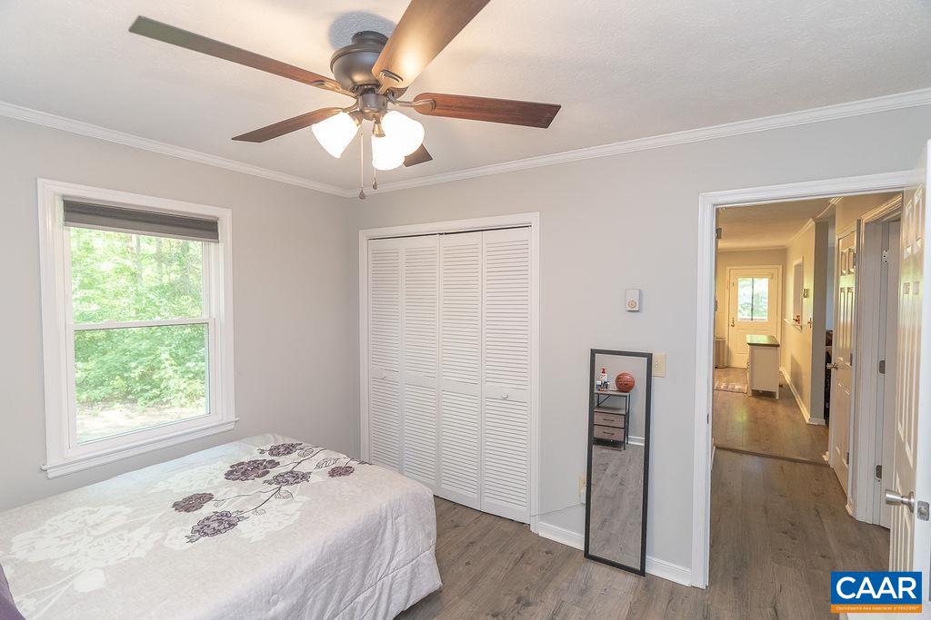 6920 Albevanna Spring Road Scottsville, VA 24590 - Photo 22 of 47 a bedroom with a bed and a window