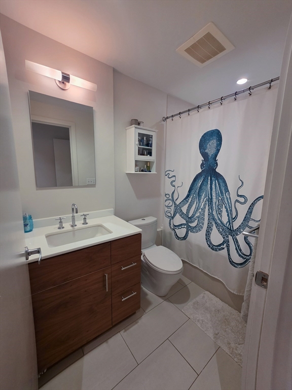 346-354 Congress Street, Unit 505 Boston, MA 02210 - Photo 8 of 14 a bathroom with a sink and a mirror