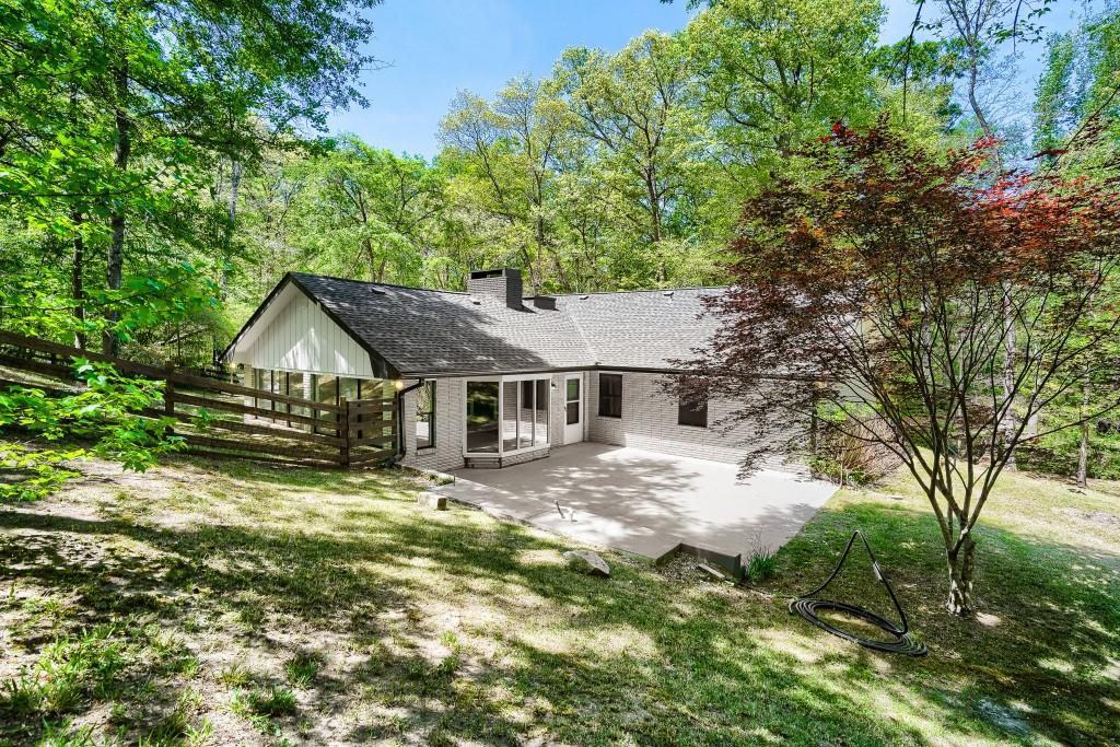 2021 Irwin Bridge Road Northwest Conyers, GA 30012 - Photo 40 of 43 front view of a house with a yard