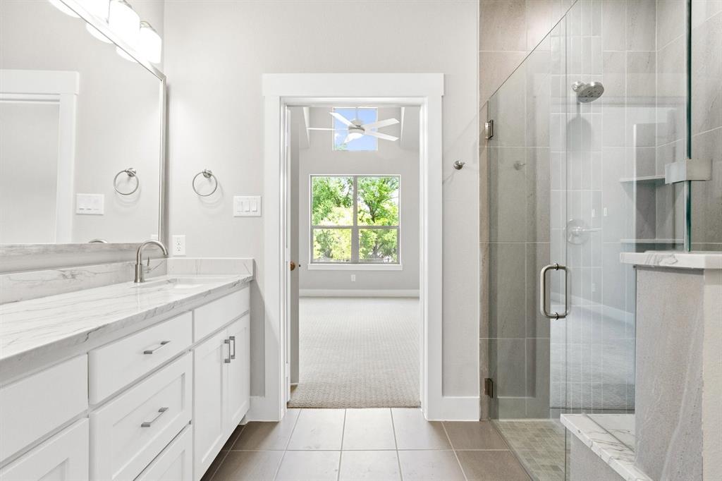 8517 Del Rio Trail Wylie, TX 75098 - Photo 18 of 30 a bathroom with a granite countertop sink a shower and a mirror
