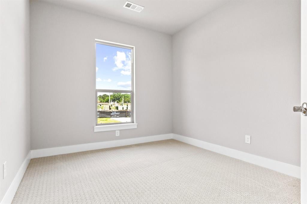 8517 Del Rio Trail Wylie, TX 75098 - Photo 21 of 30 an empty room with a window