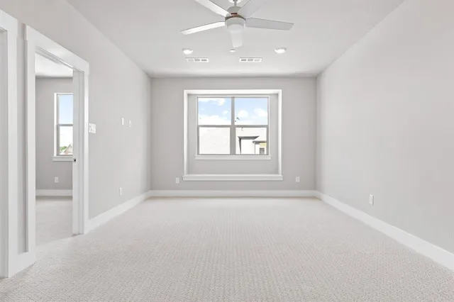 an empty room with windows and closet