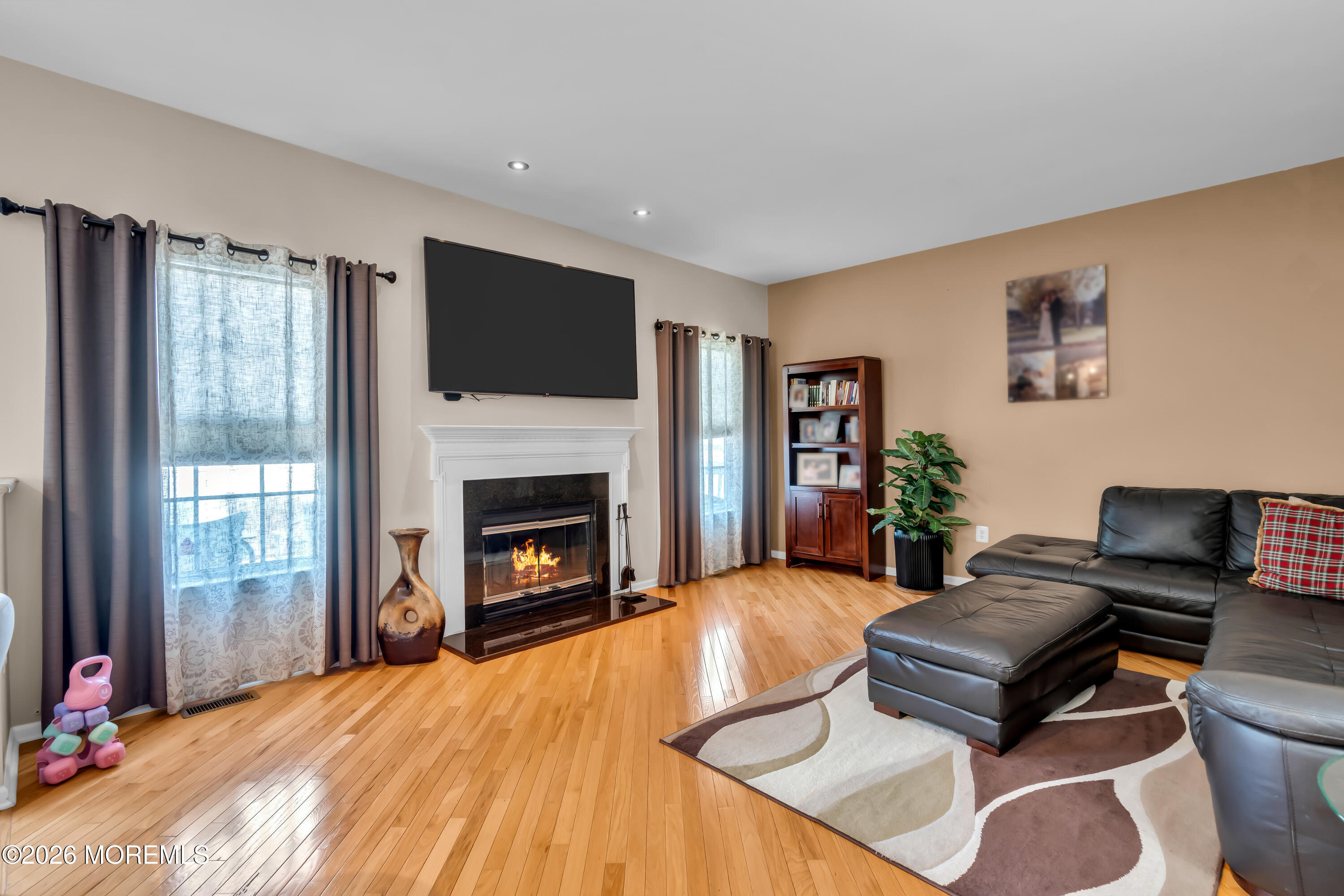 10 Beacon Place Old Bridge, NJ 08857 - Photo 16 of 72 a living room with furniture and a fireplace