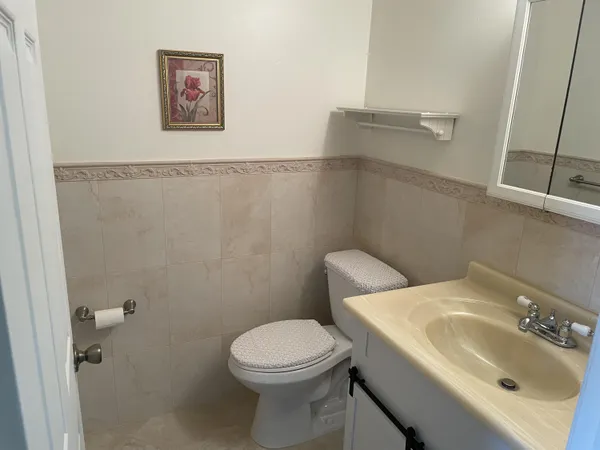 an empty room with wooden floor and a window