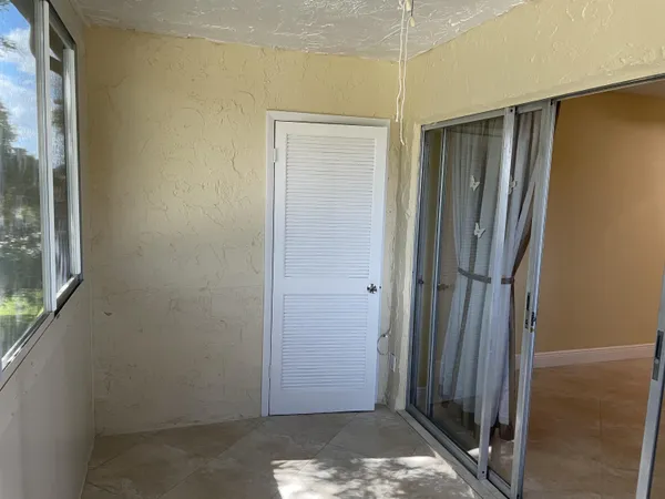 a view of an empty room with a window