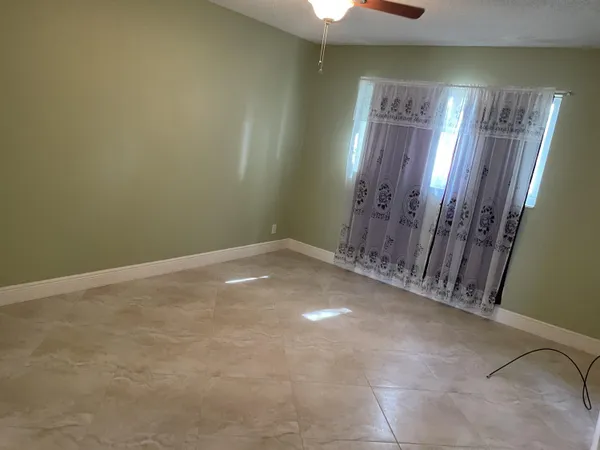 a kitchen with stainless steel appliances granite countertop a refrigerator sink and stove