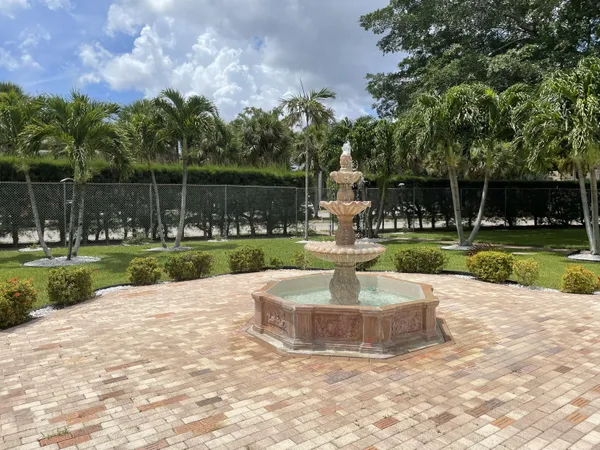 a view of a fountain with a yard