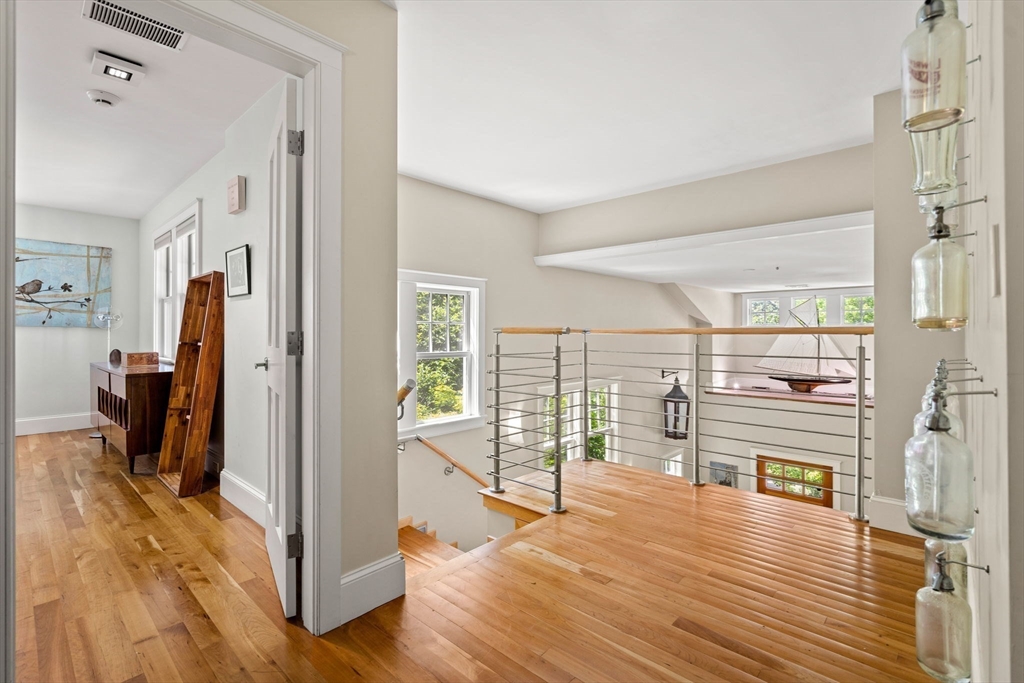 6 Beaver Pond Road Beverly, MA 01915 - Photo 19 of 36 a view of a living room with hardwood floor and a large window
