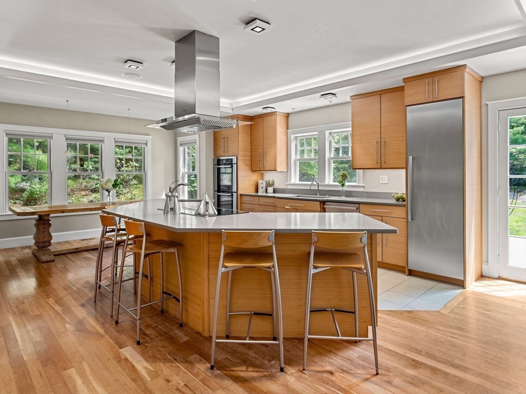 6 Beaver Pond Road Beverly, MA 01915 - Photo 3 of 36 a dining hall with stainless steel appliances granite countertop a stove and a refrigerator