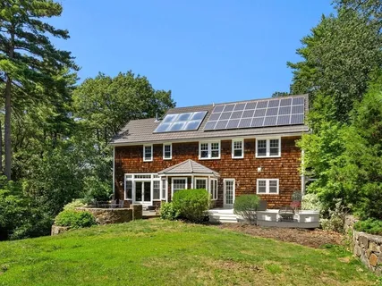 a picture of a wall with a white building and a white wall