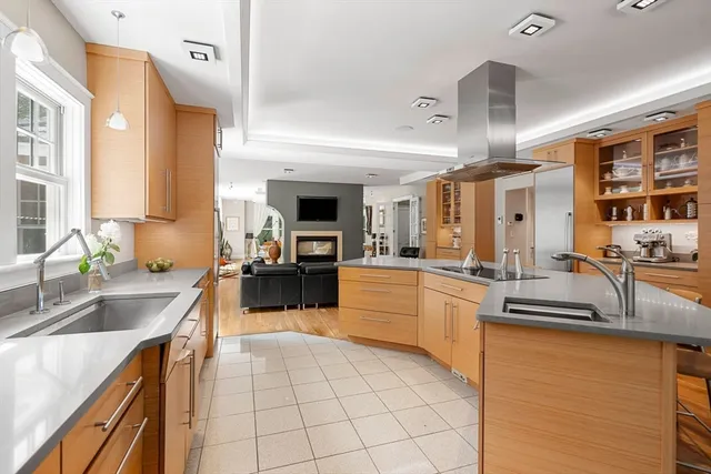 a kitchen with stainless steel appliances granite countertop a sink counter space and cabinets