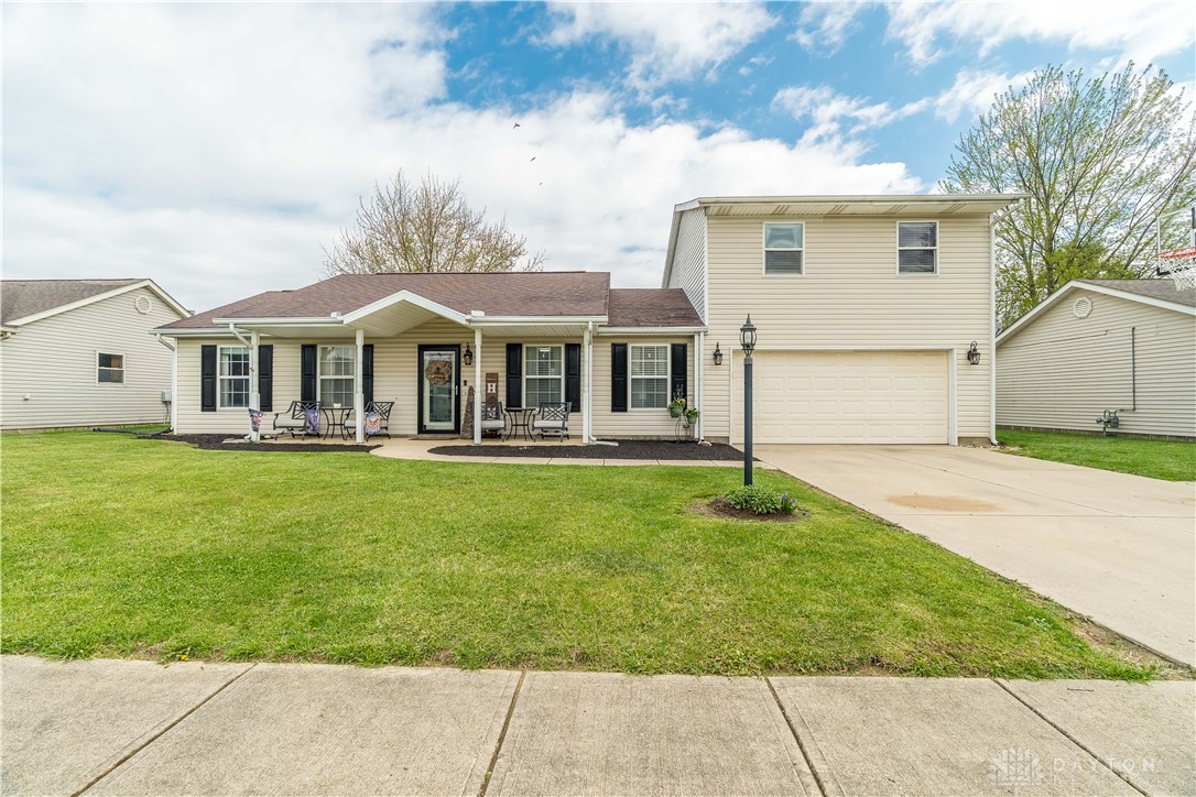 1442 Langdon Road Sidney, OH 45365 - Photo 2 of 34 This charming home offers a welcoming facade with a covered porch and ample outdoor space.