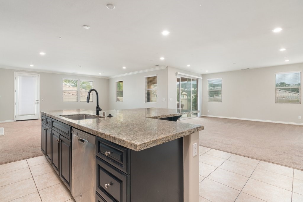 45522 Zander Court Temecula, CA 92592 - Photo 14 of 58 a kitchen with a stove and a sink