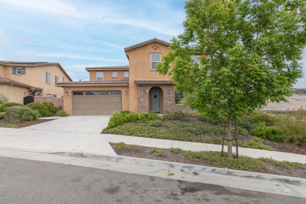 45522 Zander Court Temecula, CA 92592 - Photo 2 of 58 front view of a house with a yard