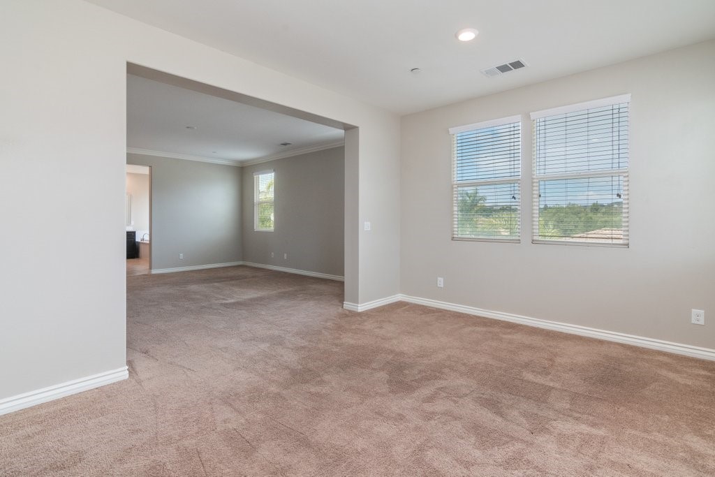 45522 Zander Court Temecula, CA 92592 - Photo 32 of 58 an empty room with windows and closet