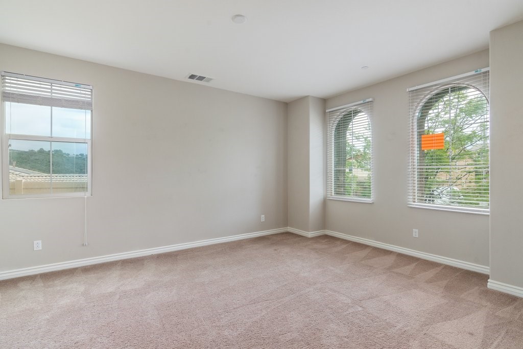 45522 Zander Court Temecula, CA 92592 - Photo 7 of 58 an empty room with windows