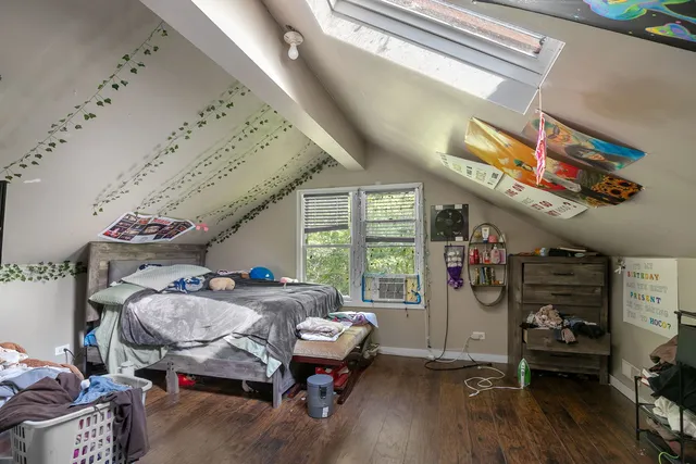 a bedroom with furniture and a window