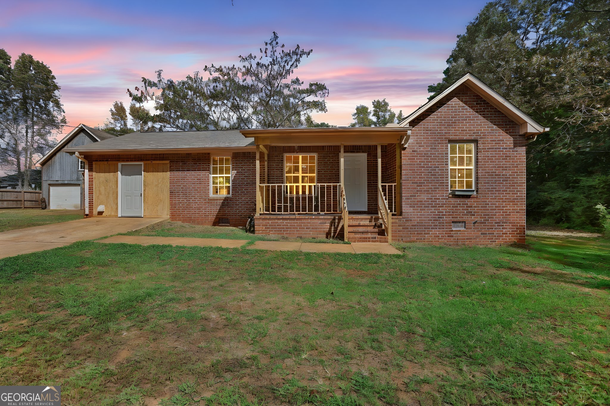 700 Camp Ground Road Griffin, GA 30223 - Photo 1 of 1 a front view of a house with a yard and garage