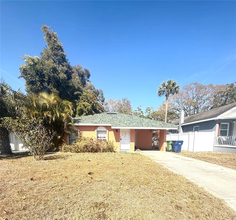 2913 West Kathleen Street Tampa, FL 33607 - Photo 1 of 5 a front view of a house with a yard
