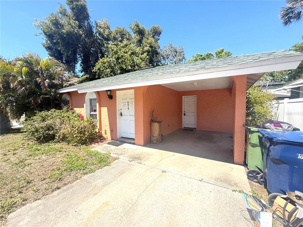 2913 West Kathleen Street Tampa, FL 33607 - Photo 2 of 5 a front view of a house with a yard