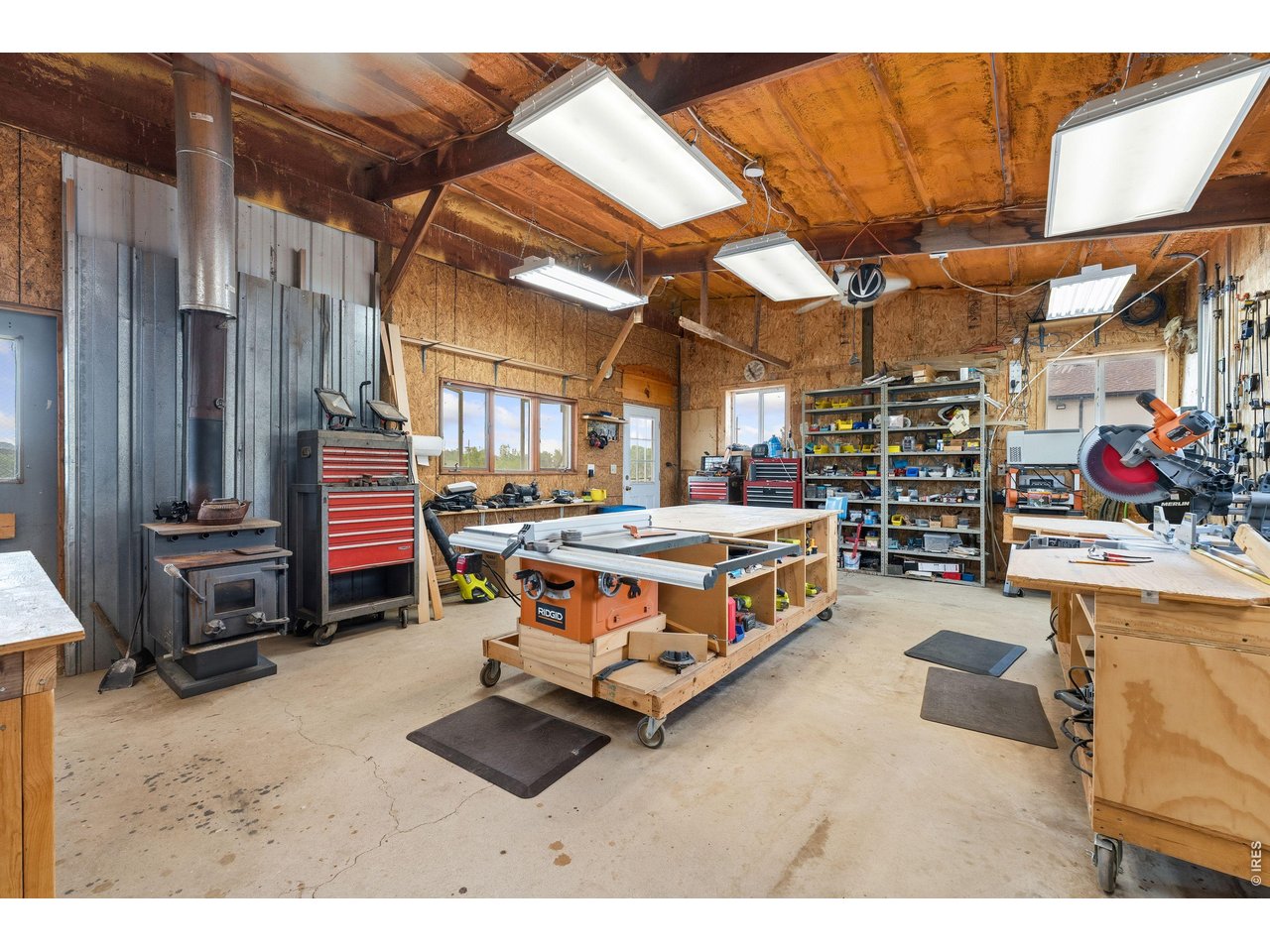 54 Rist View Road Bellvue, CO 80512 - Photo 42 of 50 Outbuilding Shop with wood burning stove!