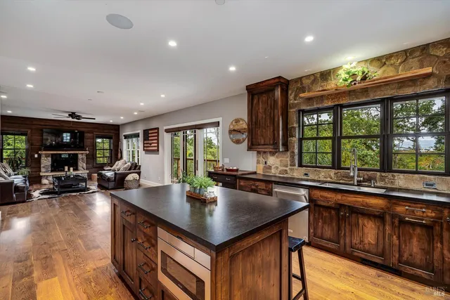 a view of hallway with wooden floor and stairs