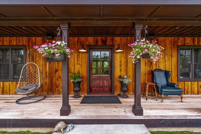 a view of an entryway with wooden floor