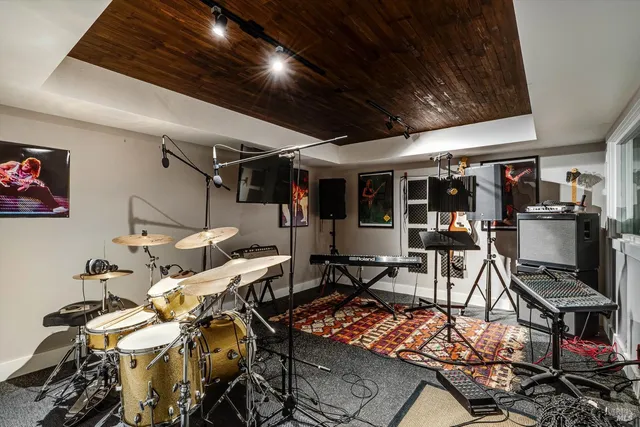 a bedroom with a bed and a flat tv screen