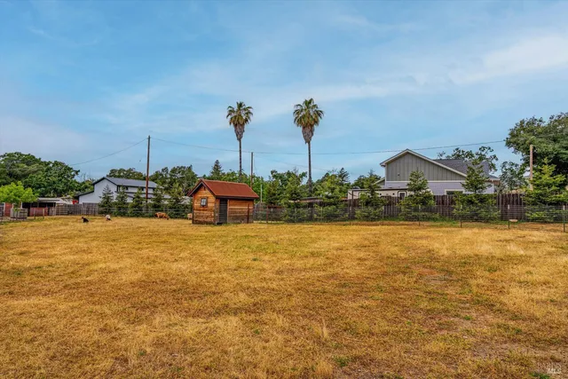 a house with trees in the background