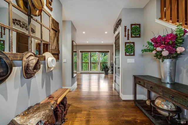 a living room with furniture ceiling fan and a fireplace