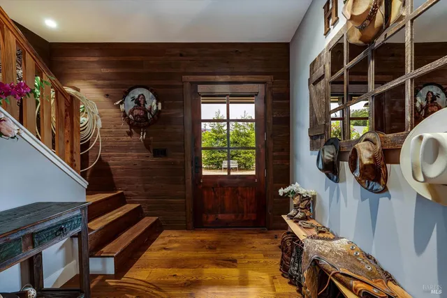 a living room with furniture ceiling fan and a fireplace