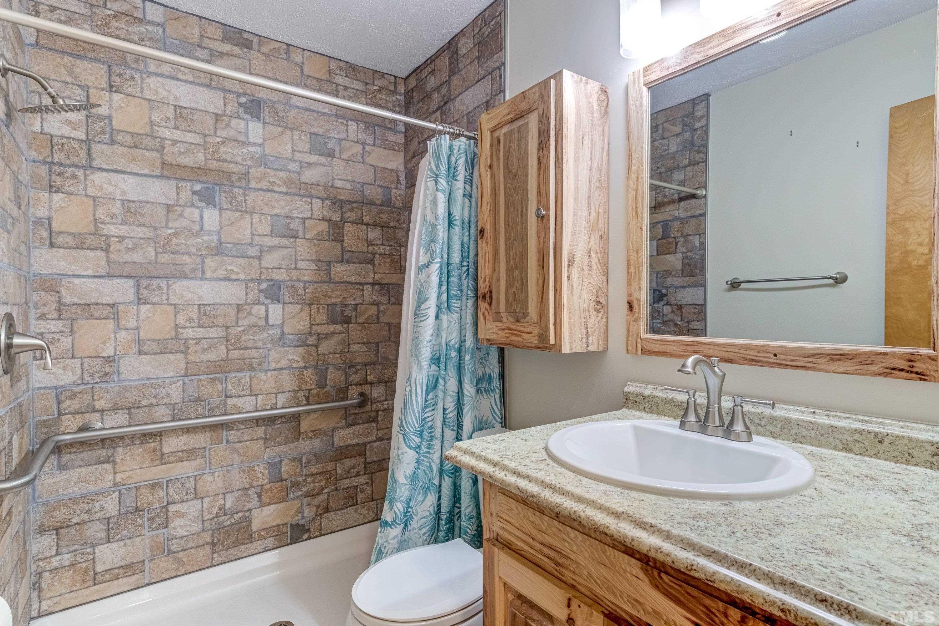 128 Spring Lane Lillington, NC 27546 - Photo 20 of 42 a bathroom with a sink and a mirror