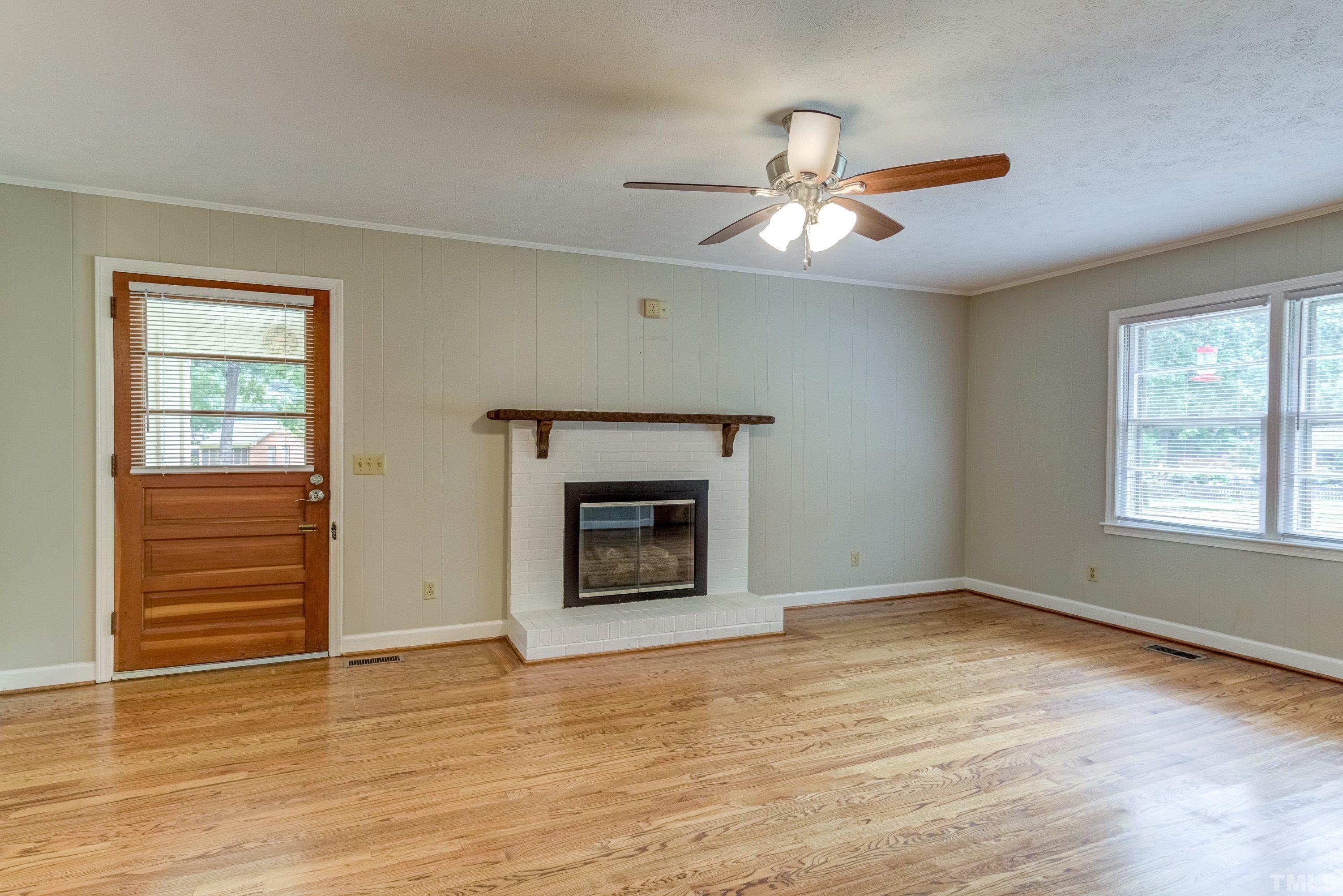 128 Spring Lane Lillington, NC 27546 - Photo 21 of 42 a view of empty room with wooden floor and fan