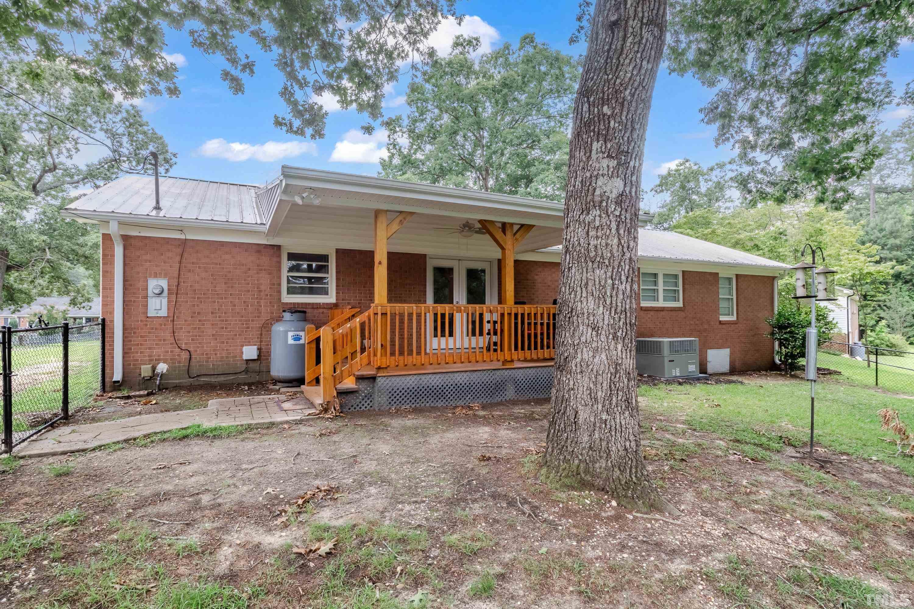 128 Spring Lane Lillington, NC 27546 - Photo 38 of 42 a view of a house with backyard