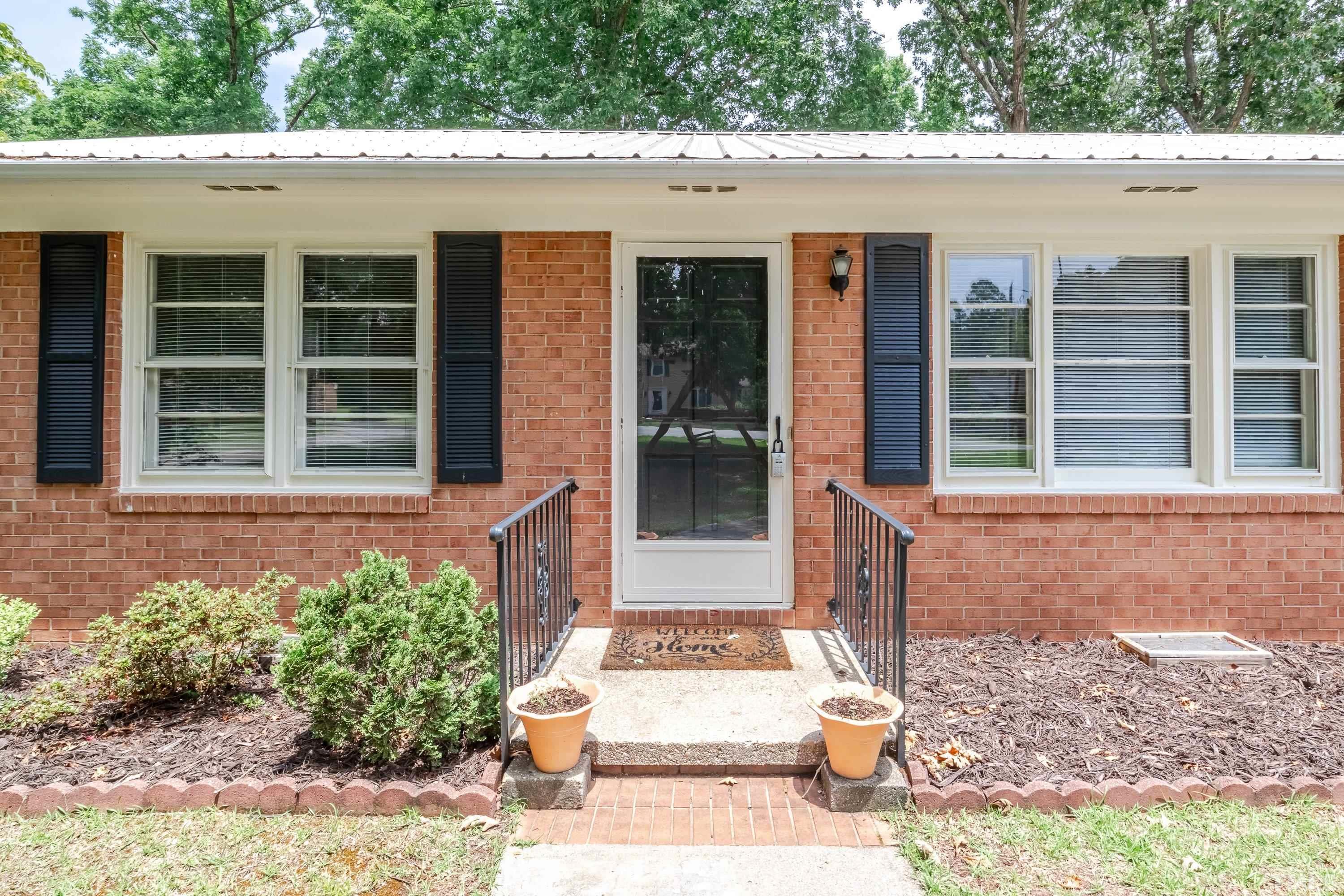 128 Spring Lane Lillington, NC 27546 - Photo 6 of 42 a front view of a house