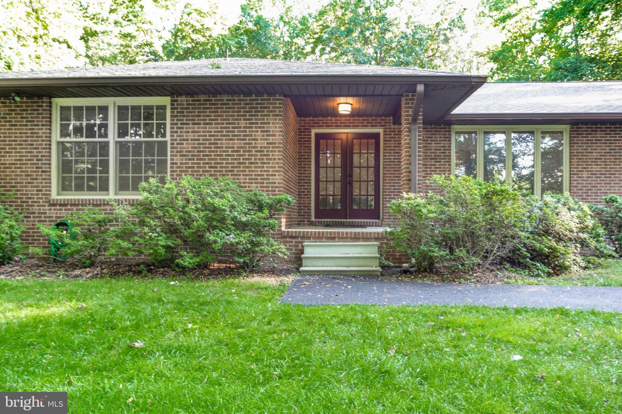 4304 Rousbys Run West River, MD 20778 - Photo 2 of 50 a view of a house with a yard plants and large tree