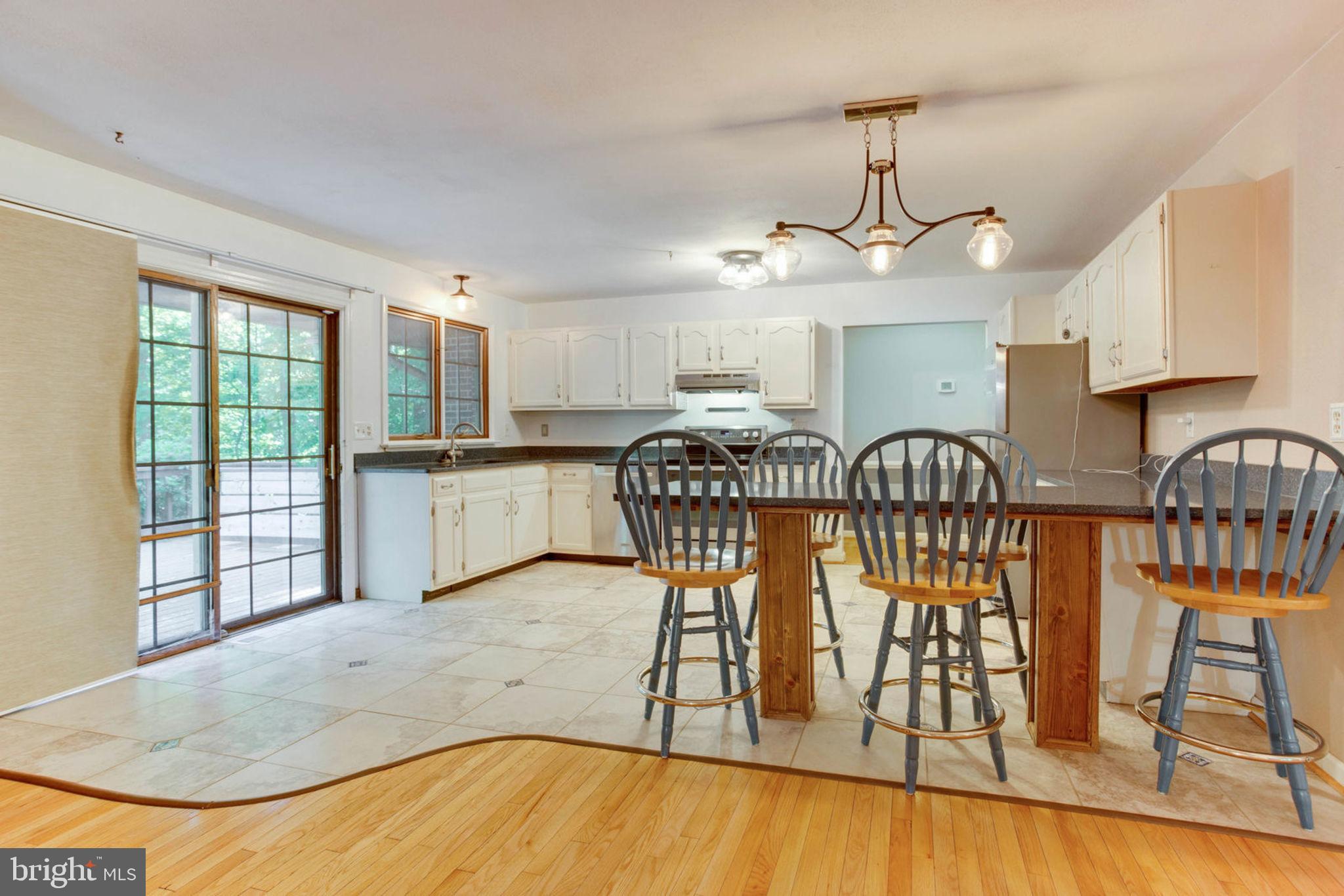 4304 Rousbys Run West River, MD 20778 - Photo 14 of 50 a view of a dining room with furniture window and wooden floor