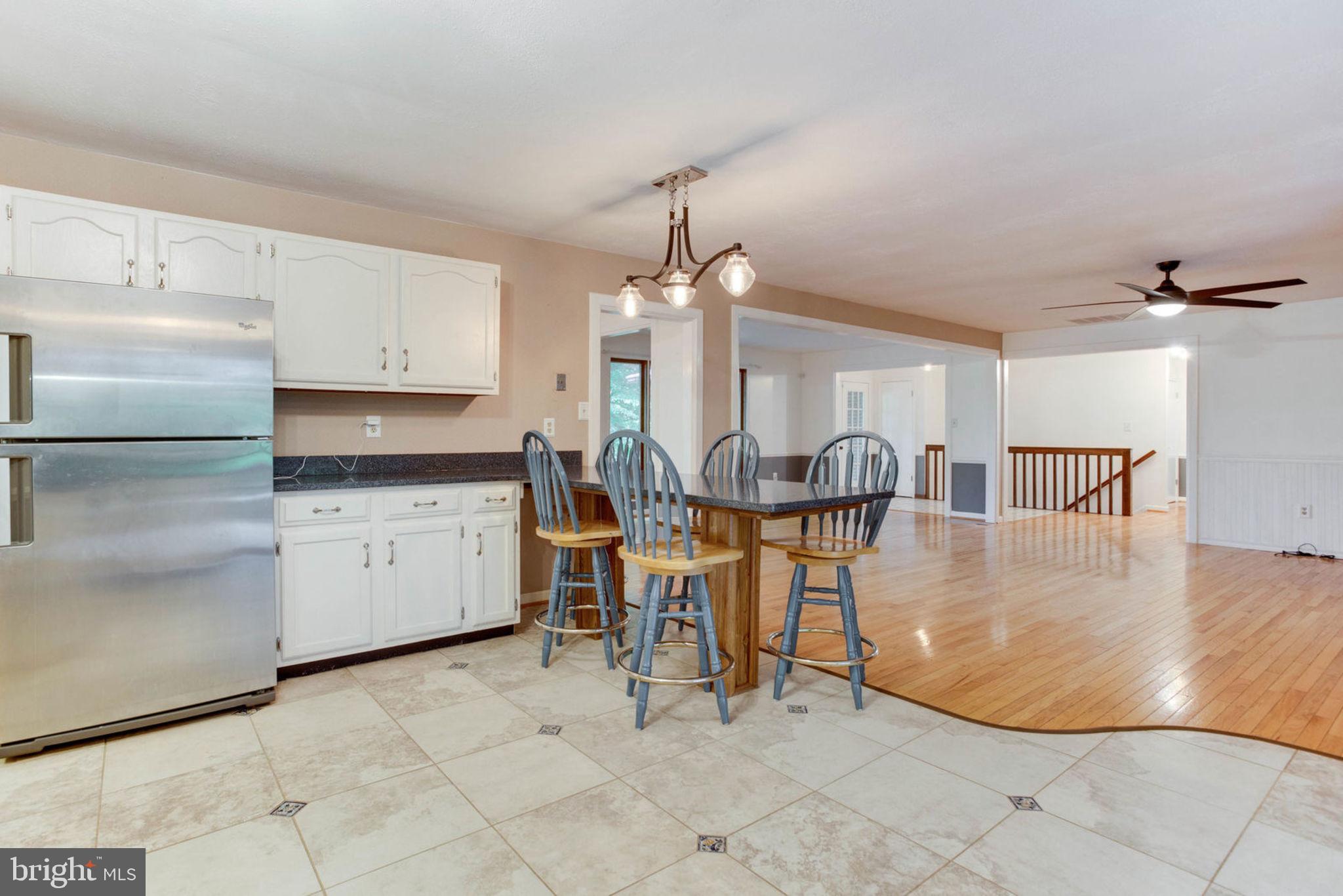 4304 Rousbys Run West River, MD 20778 - Photo 15 of 50 a view of a kitchen with furniture and chandelier